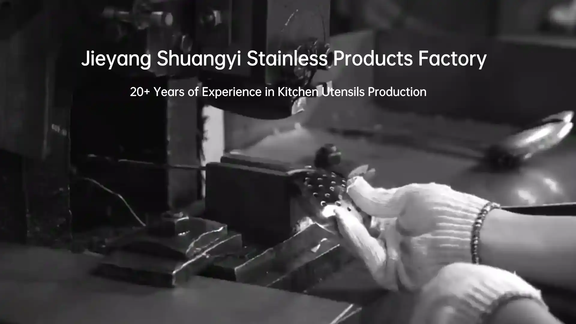 A worker is making a stainless steel skimmer by machine