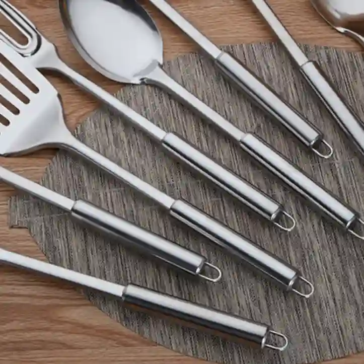 The stainless steel handles of the kitchen utensils