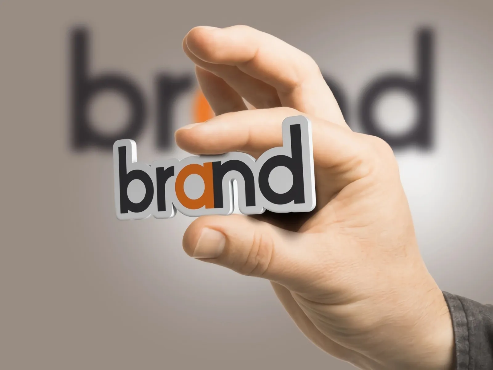 One hand held a "Brand" word card