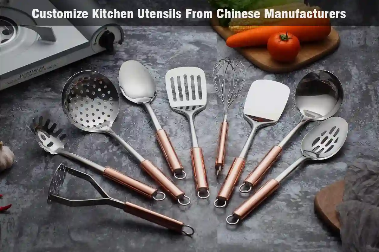 Set of stainless steel kitchen utensils or cooking utensils arranged in a fan viewed on grey tabletop