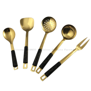 Luxury gold-plated kitchen utensils set with black marble finish handles, arranged in a fan viewed against white background