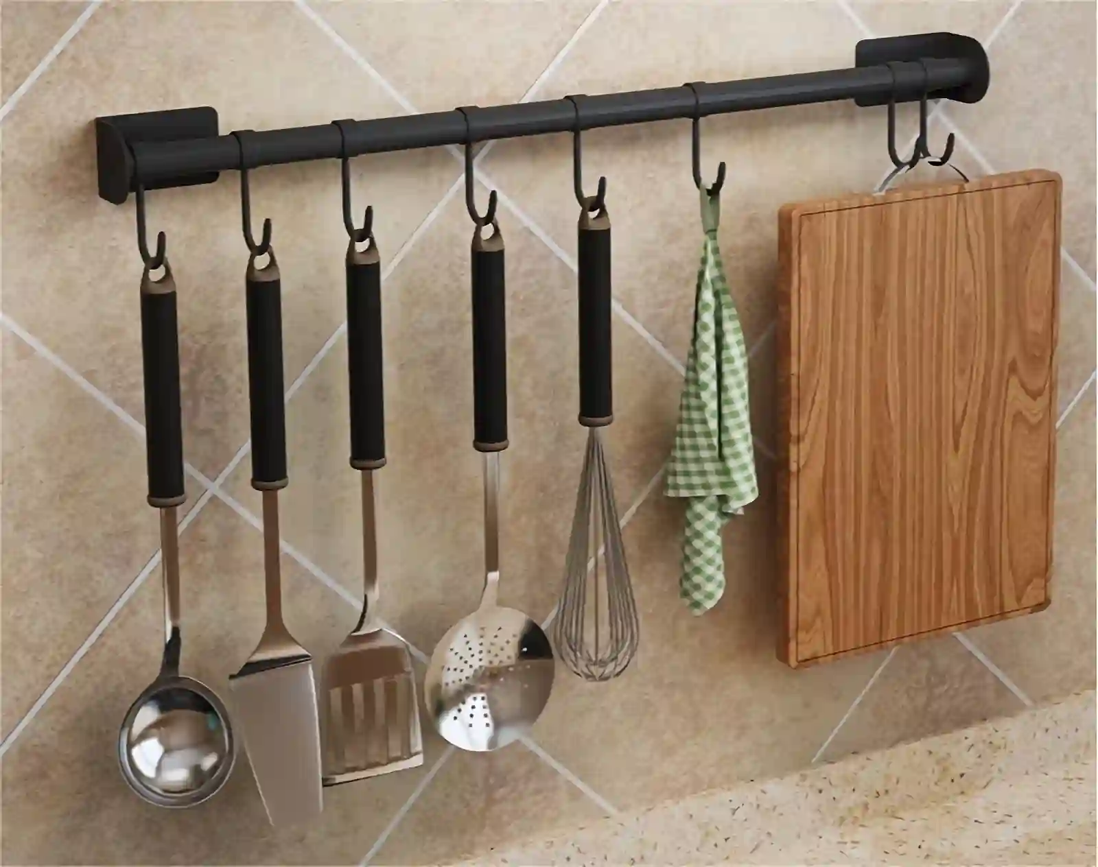 Kitchen utensils hang on the wall-mounted rack and rails