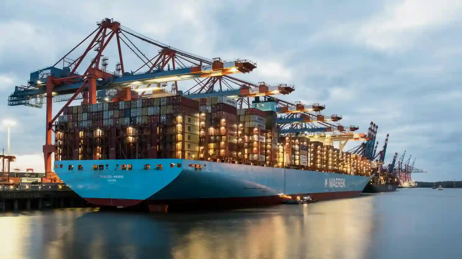 A large cargo ship docked at a dock